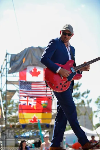 Steve Strongman performing on guitar